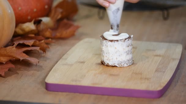 Woman in kitchen making pumpkin small cake - Footage, Video