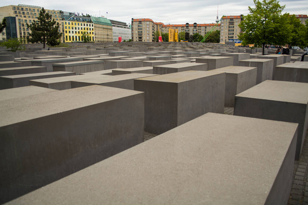 14.05.2019. Berlin, Germany. Holocaust monument. View in the field from concrete slabs of the different size and height. City sights, tourist place. - Photo, Image