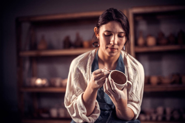 Stylish craftsmen enjoying pottery art and production process. Concept for woman in freelance, business, hobby. - Φωτογραφία, εικόνα
