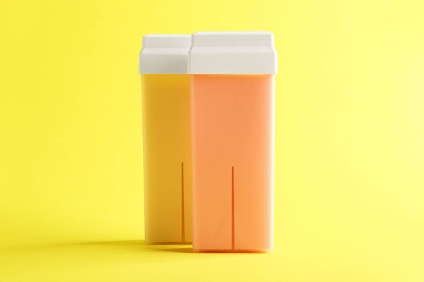 Liposoluble wax cartridges on color background - Photo, Image