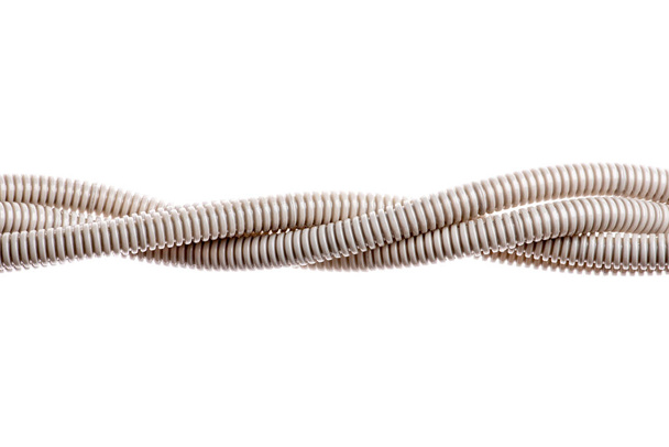 Plastic corrugated pipe isolated on white background  - 写真・画像