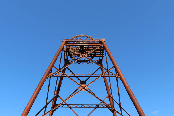 a rusty old poppet head structure left over from the gold mining days - Photo, Image