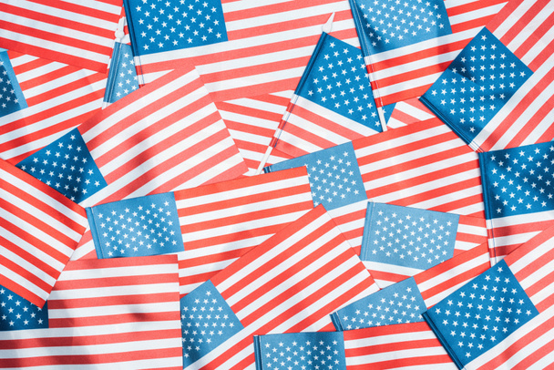 background of shiny national american flags in stack - Foto, Imagen