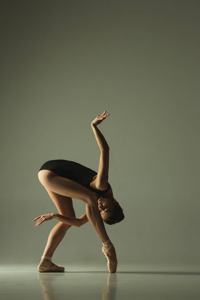 Young graceful female ballet dancer dancing in mixed light - Φωτογραφία, εικόνα