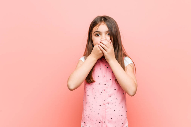 Cute little girl shocked covering mouth with hands. - Photo, Image