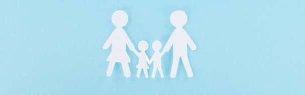 top view of white paper cut family on blue background, panoramic shot  - Photo, Image