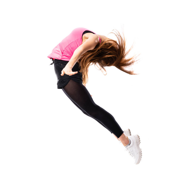 Joven bailarina sobre fondo blanco aislado saltando
 - Foto, Imagen