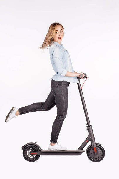 young woman with electric scooter - Φωτογραφία, εικόνα