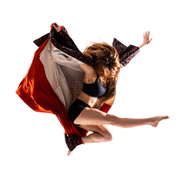 Young dance girl with kimono jumping - Photo, Image