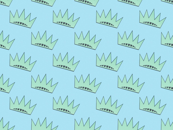 seamless background pattern with turquoise crowns on light blue, Independence Day concept - Photo, image
