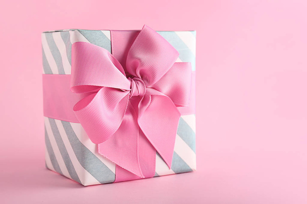 Beautiful gift box on color background - Foto, imagen