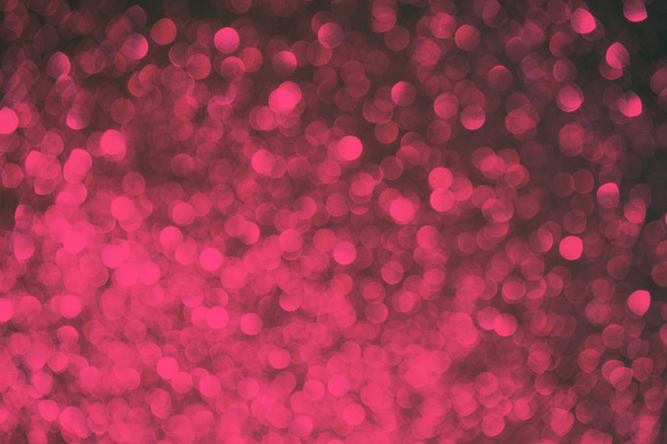 Blurred bokeh dark pink purple coral and black background, Christmas and New Year party holidays concept. - Foto, Imagem