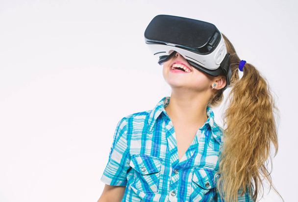 Get virtual experience. Girl cute child with head mounted display on white background. Virtual reality concept. Small kid use modern technology virtual reality. Virtual education for school pupil - Foto, imagen