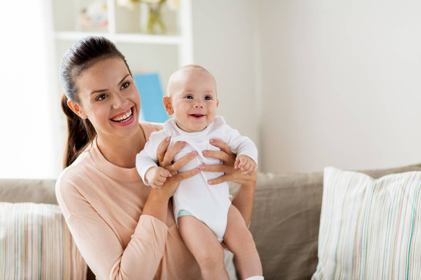 happy mother with little baby boy at home - Foto, Imagen