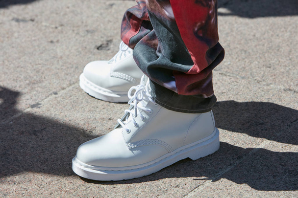 Man with white combat boots and red trousers before Cristiano Burani fashion show, Milan Fashion Week street style on September 20, 2017 in Milan. - Valokuva, kuva
