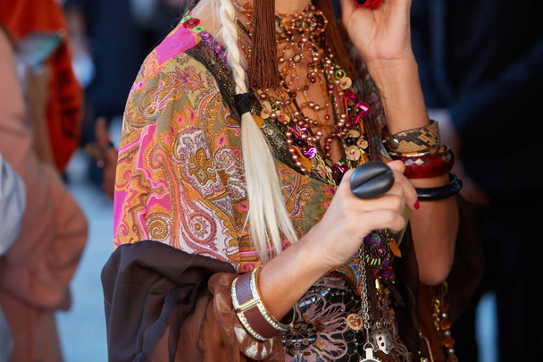 Woman with colorful ethnic shirt and accessories before Alberta Ferretti fashion show, Milan Fashion Week street style on September 20, 2017 in Milan. - Φωτογραφία, εικόνα