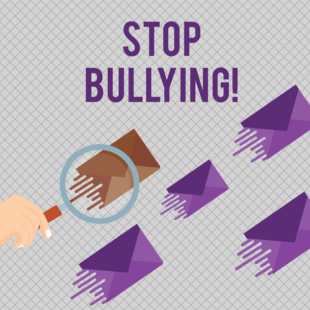 Conceptual hand writing showing Stop Bullying. Business photo showcasing stop the aggressive behaviour among school aged children Magnifying Glass on Color Envelope and others has Same Shade. - Photo, Image