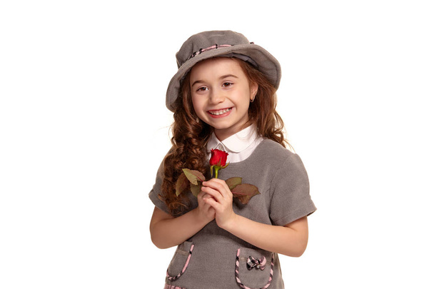 Full length shot of a lovely little kid with a long, curly hair posing isolated on white background. - Foto, imagen