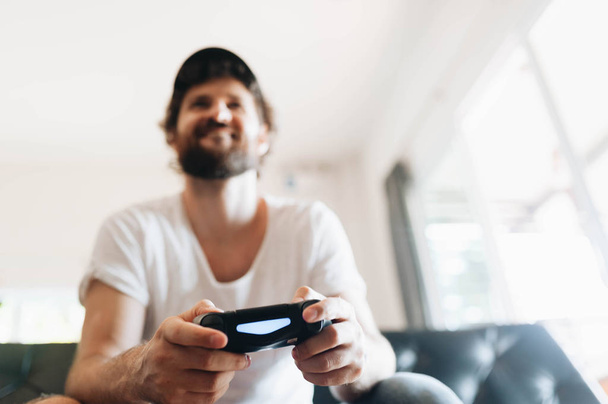 A man playing video games - Photo, image