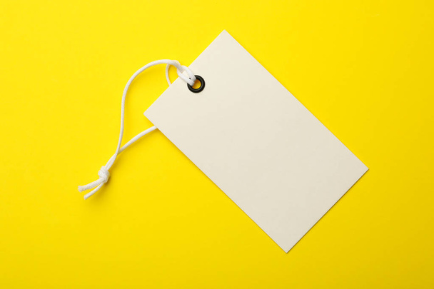 Cardboard tag with space for text on color background, top view - Fotografie, Obrázek