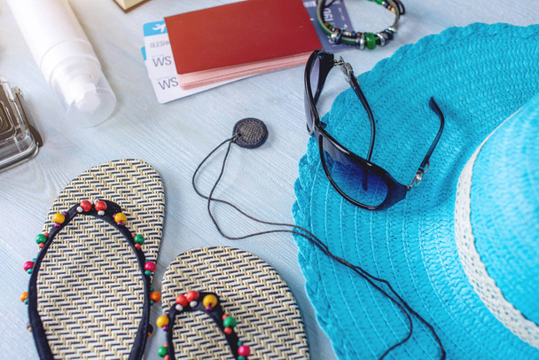Travel holiday supplies on blue background. Summer going on a trip to the sea. Top view. Flat lay - Photo, Image