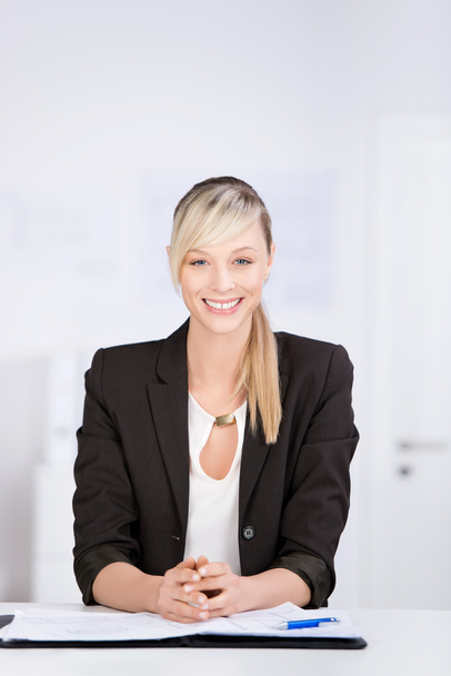 Beautiful businesswoman sitting at her office desk - Photo, Image
