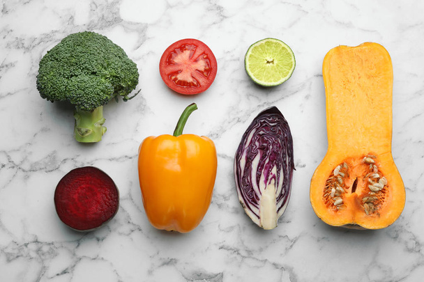 Flat lay composition with fresh ripe vegetables on marble background - Fotografie, Obrázek