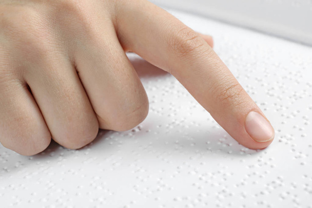 Blind person reading book written in Braille, closeup - Фото, изображение