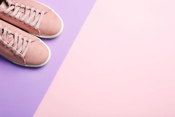 Bright stylish shoes on color background, top view. Space for text - Valokuva, kuva