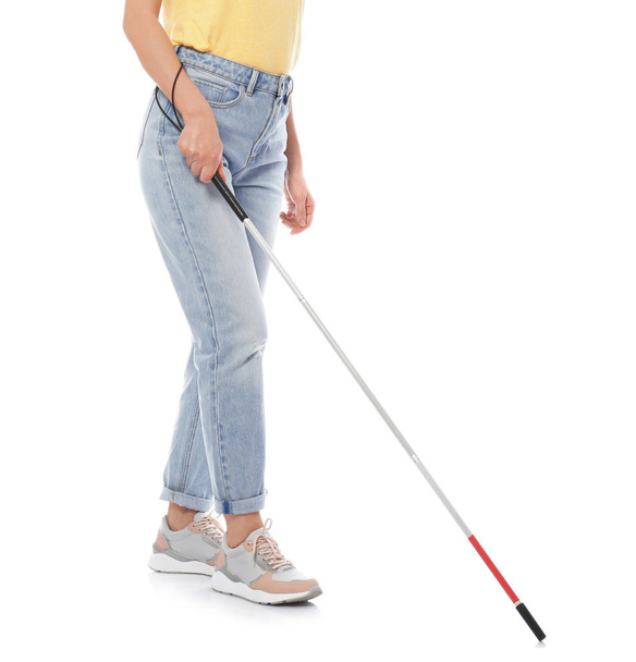 Blind person with long cane walking on white background - Valokuva, kuva