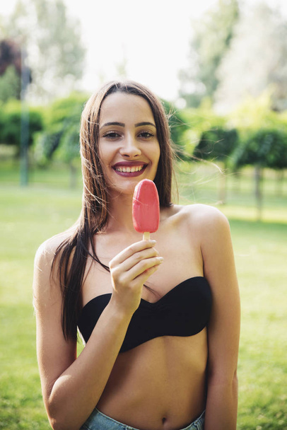 Portrait of young woman with ice cream  - Zdjęcie, obraz