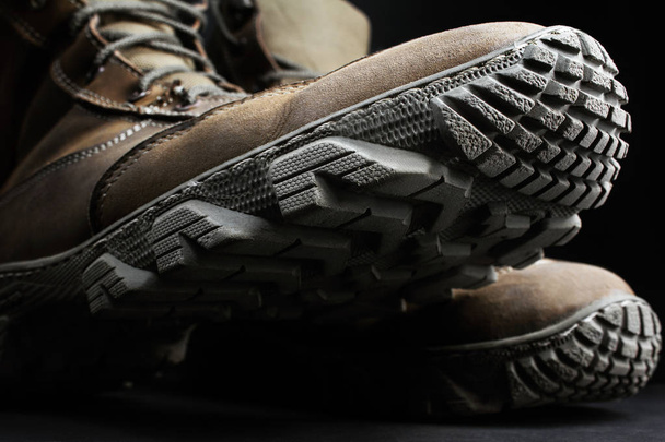 Closeup photo of military boots and protector. - Photo, Image