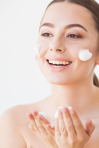 Beauty Face Care. Woman With Cream On Facial Skin - Foto, imagen