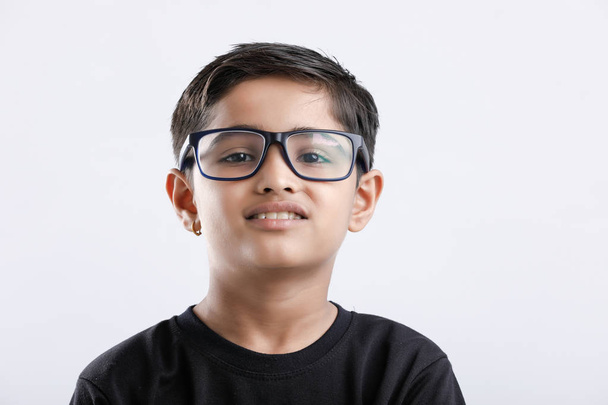 Indian child wearing spectacles and looking seriously - Fotó, kép
