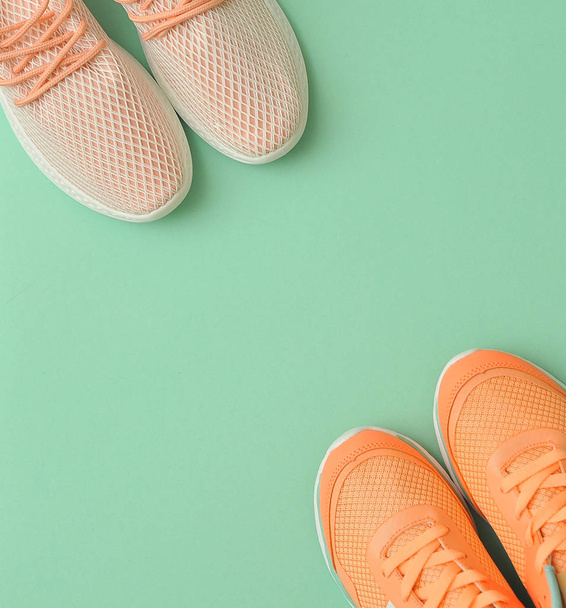 Sporty shoes and bottle on pink background. - Φωτογραφία, εικόνα