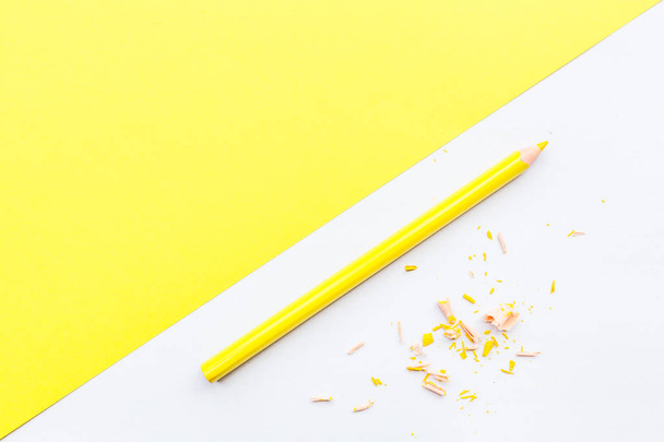 Mockup Blank page with yellow pencil. Top view with copy space for input the text. Flat lay, yellow background - Foto, Imagem