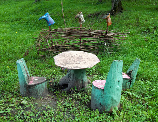 Table and chairs made of stumps and natural material - Photo, Image