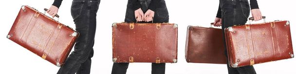 collage of woman in jeans holding vintage weathered suitcases isolated on white - Фото, изображение