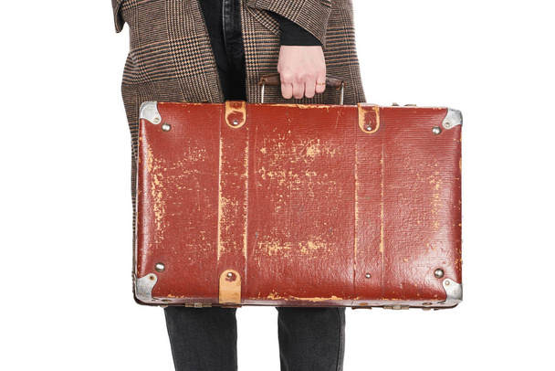 partial view of woman in plaid coat holding vintage weathered suitcase isolated on white - Photo, Image