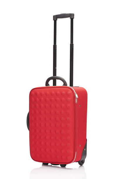 red wheeled colorful suitcase with handle isolated on white - Valokuva, kuva