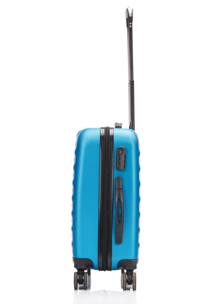 side view of blue wheeled colorful suitcase with handle isolated on white - Fotoğraf, Görsel