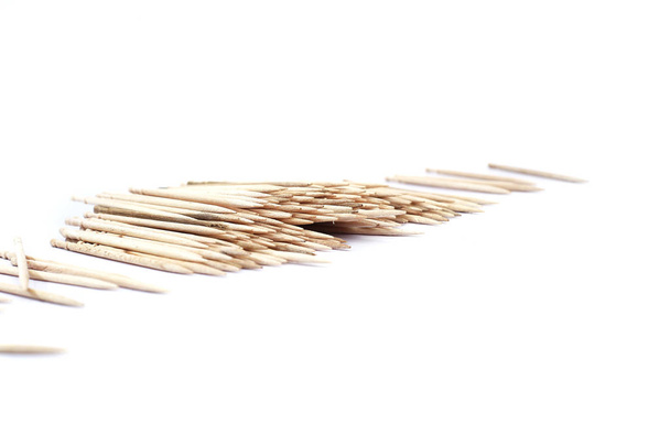 Portrait of brown toothpicks. Isolated on the white background. - Photo, Image