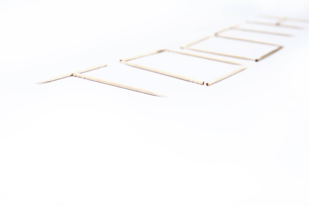 Picture of wooden toothpicks design. Isolated on the white background. - Foto, Bild