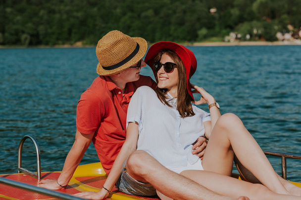 Cheerful man and woman having fun while boating. - Fotoğraf, Görsel