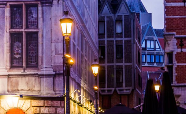 lighted lampposts with old classical architecture, The city of antwerp by night, Antwerpen, Belgium - Photo, Image