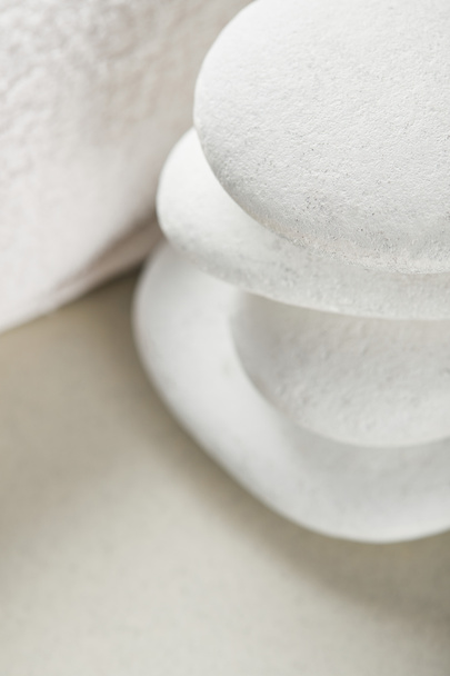 close up view of stones in stack near white cotton towel - 写真・画像