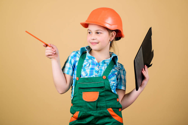 Build your future yourself. Initiative child girl hard hat builder worker. Child care development. Safety expert. Foreman inspector. Builder engineer architect. Future profession. Kid builder girl - Foto, immagini