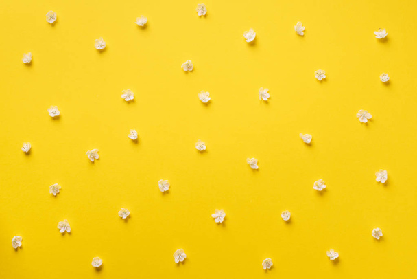 Daisy pattern. Top view. Flat lay. Floral pattern of white chamomile flowers on yellow background. Summer concept - Fotó, kép