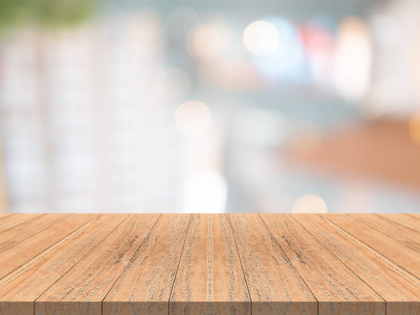 Wood table top on blurred background from shopping mall - Photo, Image
