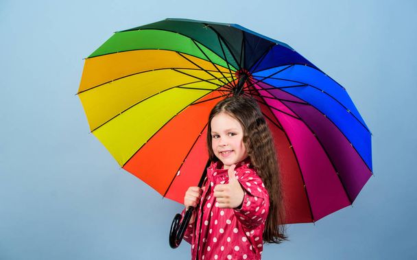 autumn fashion. Small girl in raincoat. rain protection. Rainbow. cheerful hipster child in positive mood. happy small girl with colorful umbrella. Place you want to be - Fotografie, Obrázek